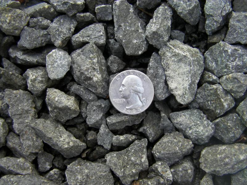 1 1/4 minus crushed basalt darker gray in color.  