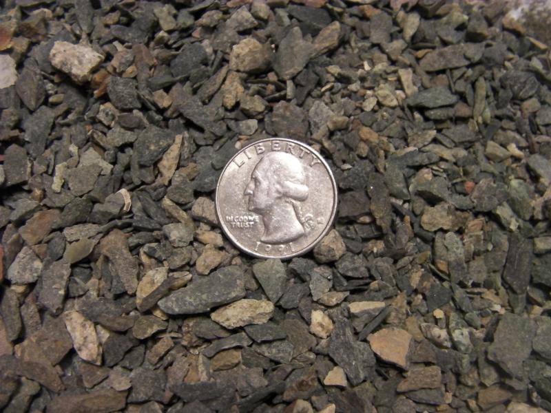3/8th Minus Crushed Rock with fines.  Quarter to help show size.